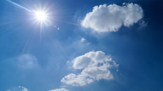An image of blue sky and sun