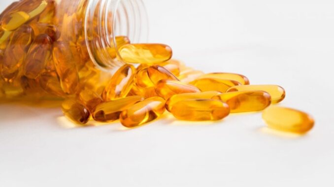 capsules-close-up-color-208518-Healthylivinglinks A bottle pouring out Omega-3 capsules