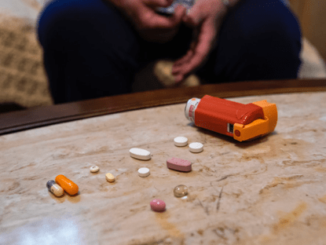 Some pills on table and a medical device