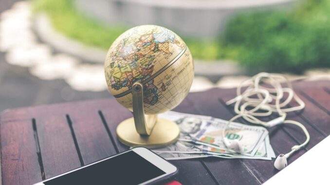 travel and Health HealthyLivingLinks-globe on a table