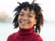 A happy woman with smile and curly hair