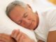 A man sleeping on the bed