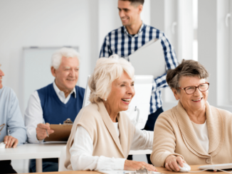 Some senior people have smile and playing computer