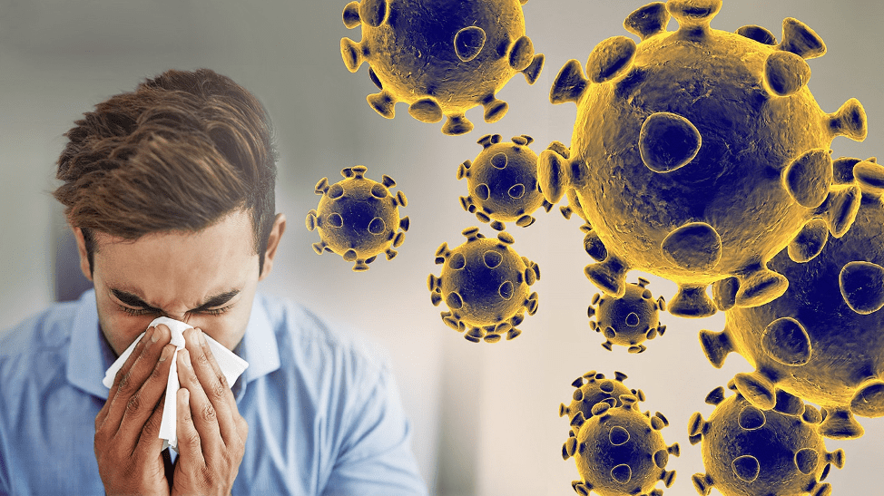 A man sneezing and some virus image beside
