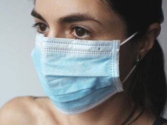 A woman wearing surgical mask.