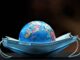 The earth model lying on the blue medical mask.