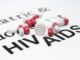 The HIV AIDS background and some tablets of medicine.