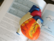 Generic_Xarelto- a model of heart laying above a book