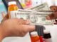 A bottle of medicine and money for trading.