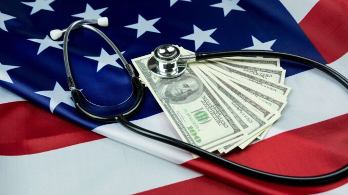 American Flag with US dollars and Stethoscope